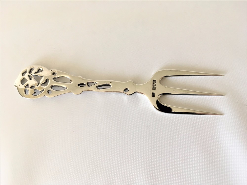 A  fabulous Edwardian tea table silver serving fork. View V