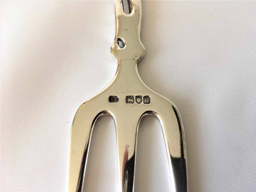 A  fabulous Edwardian tea table silver serving fork. View VI