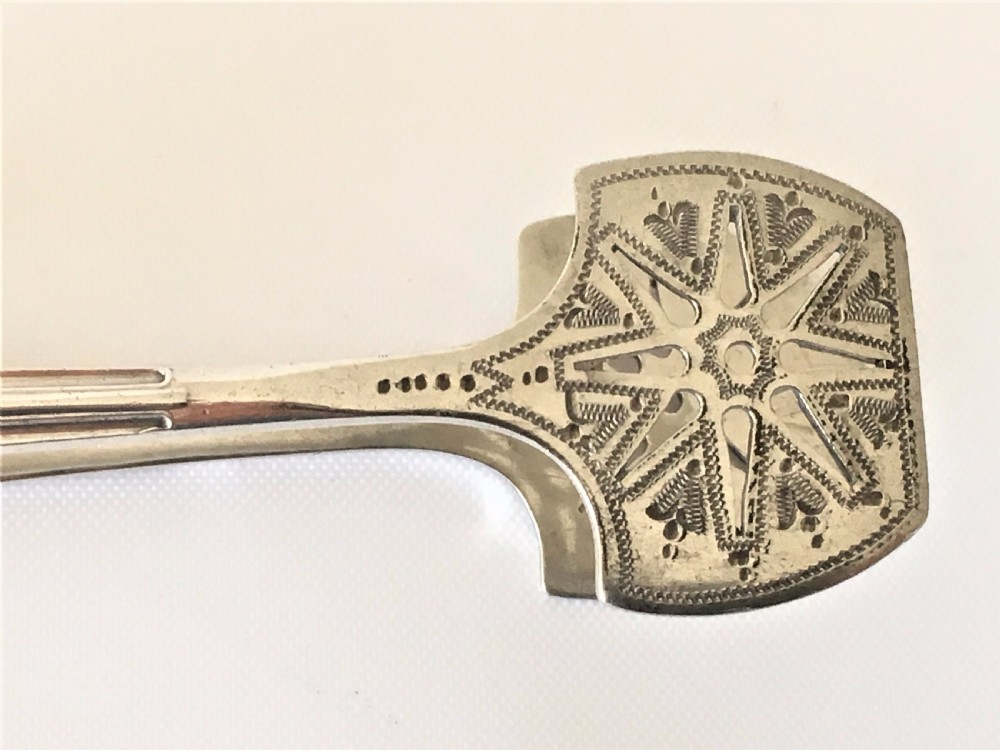 An extremely rare pair of silver Onslow pattern sardine tongs. View V