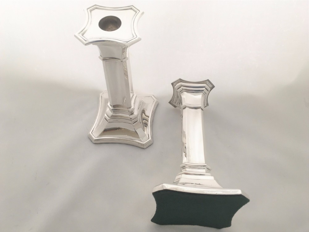 A handsome pair of Edwardian silver candlesticks. View III