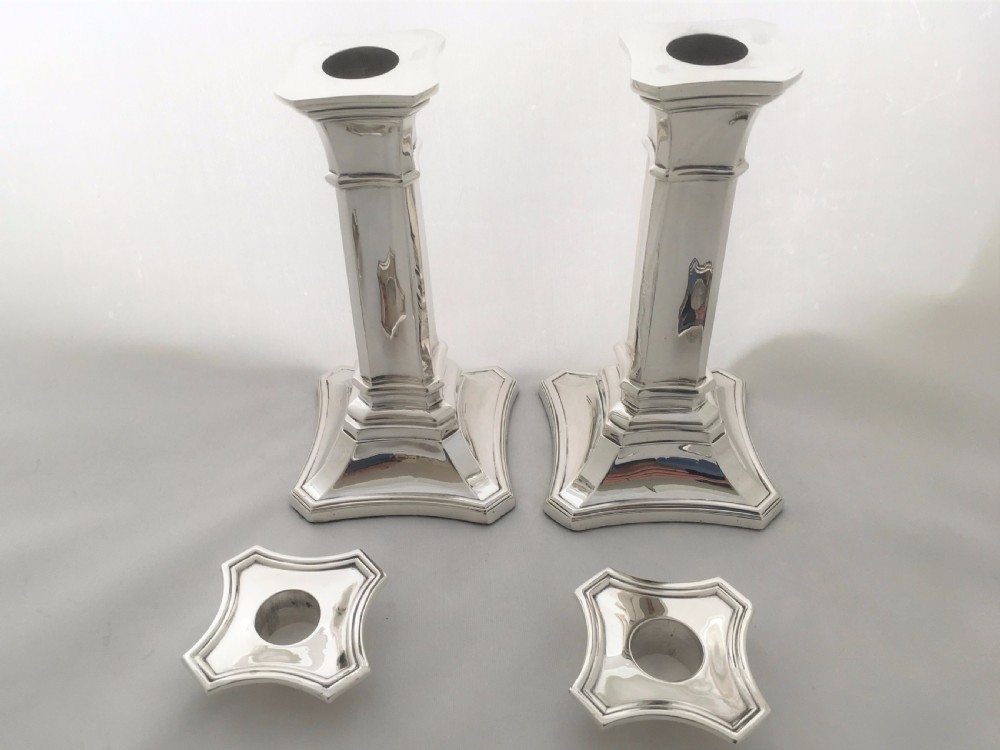 A handsome pair of Edwardian silver candlesticks. View IV