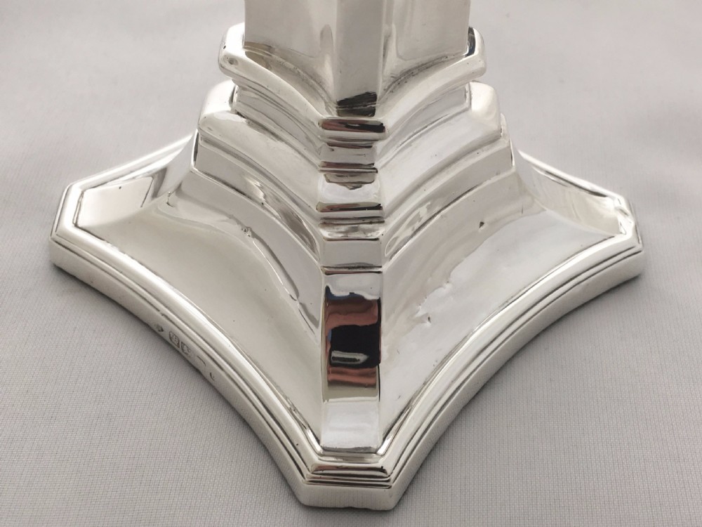 A handsome pair of Edwardian silver candlesticks. View VII