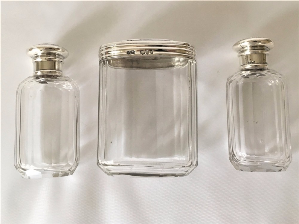 A set of three Victorian silver mounted dressing table jars. View III