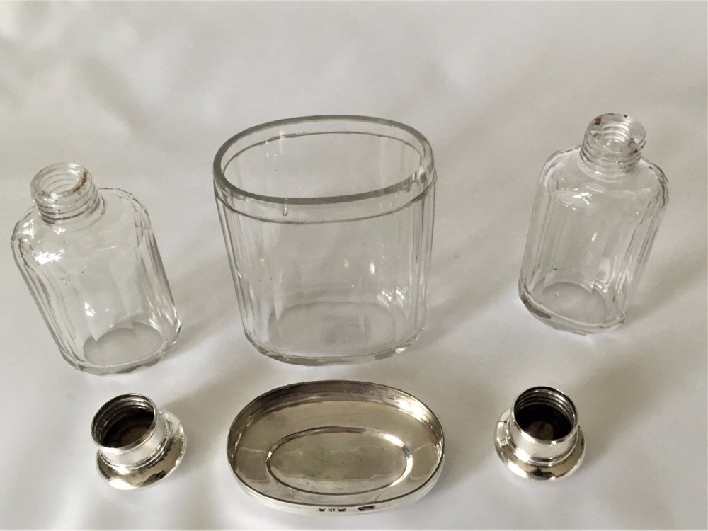 A set of three Victorian silver mounted dressing table jars. View VI