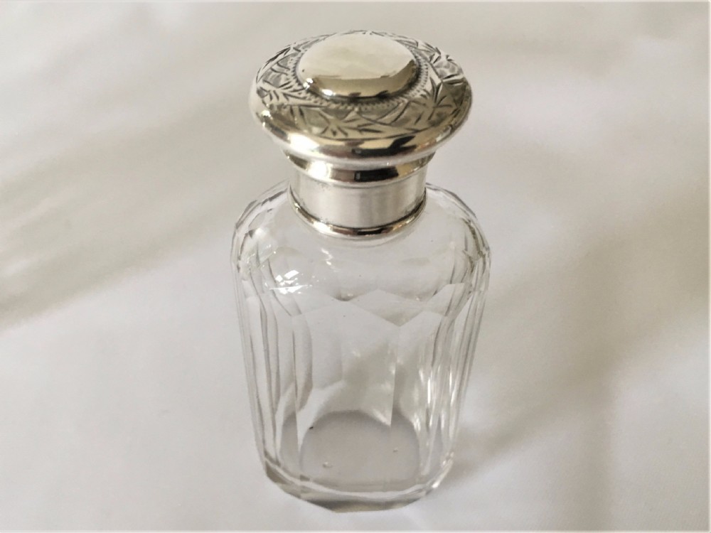 A set of three Victorian silver mounted dressing table jars. View VII