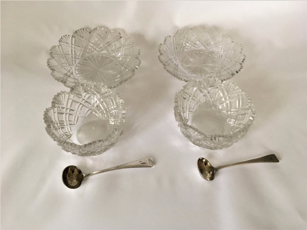A fabulous pair of Regency cut glass condiment tubs & silver spoons. View IV