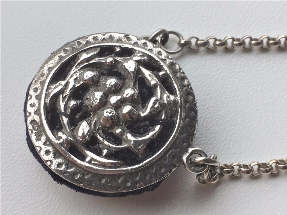An Edwardian silver 'wheel' pincushion. View II