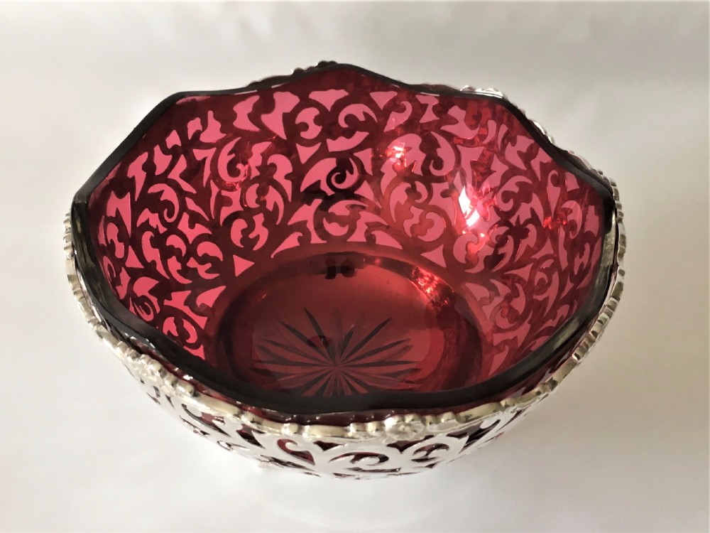 A stunning Edwardian pierced silver and cranberry bowl. View II