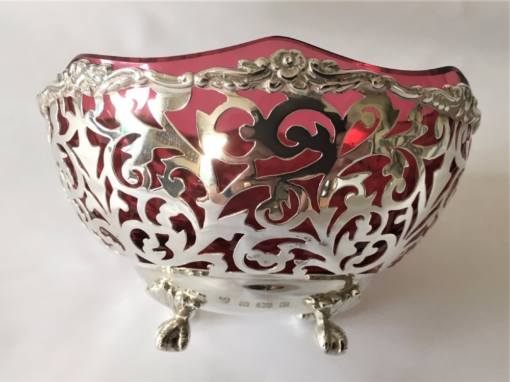 A stunning Edwardian pierced silver and cranberry bowl. View V
