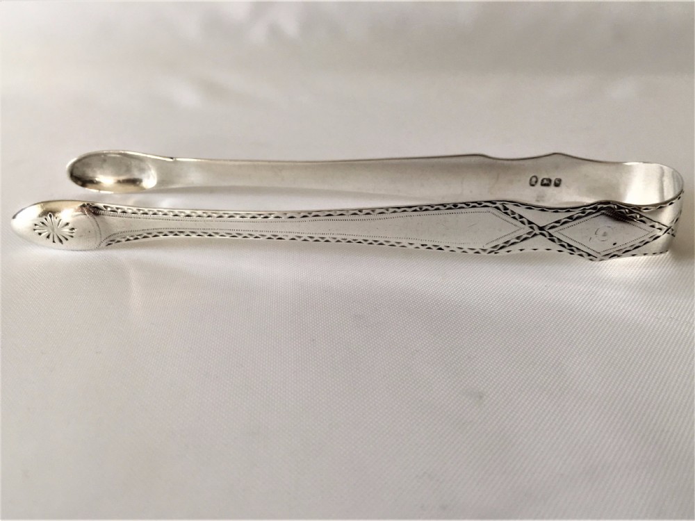 A gorgeous pair of 18th Century silver tongs. View II
