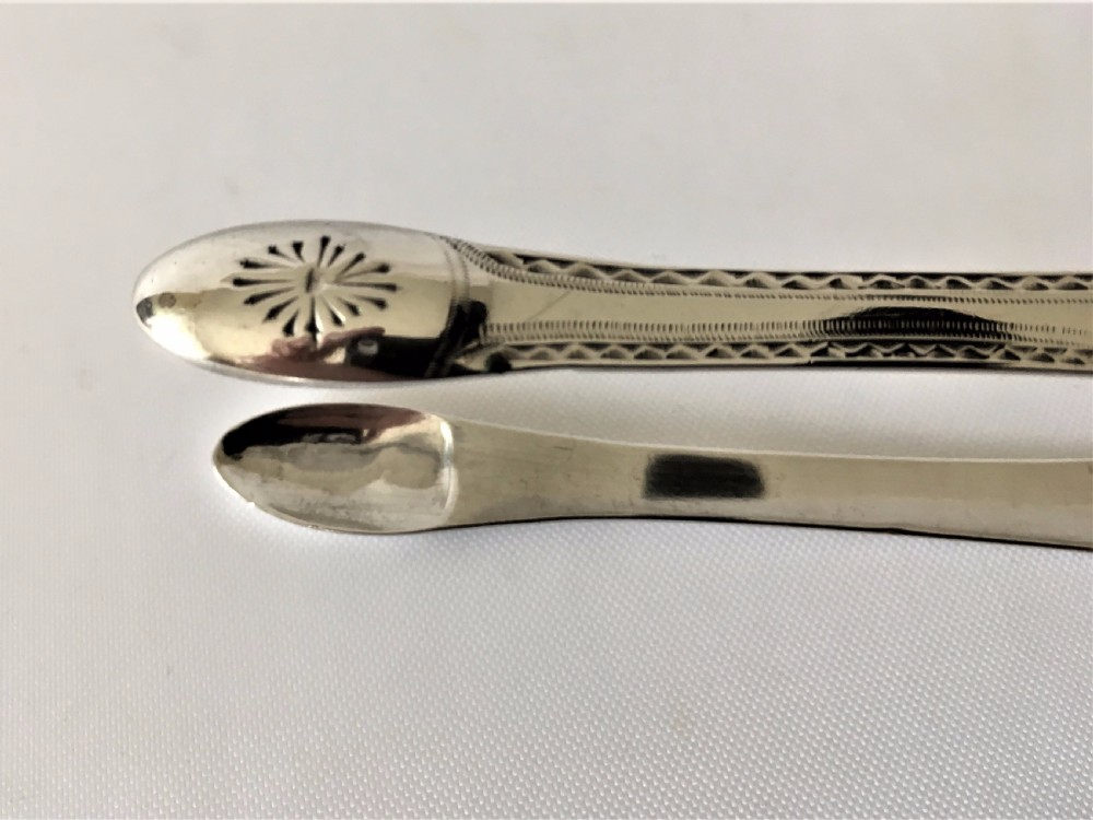 A gorgeous pair of 18th Century silver tongs. View VII