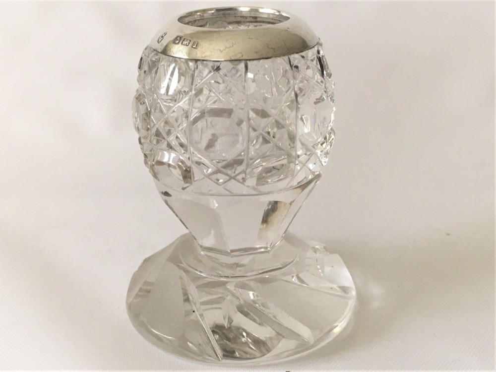 An unusual Edwardian silver mounted match striker.