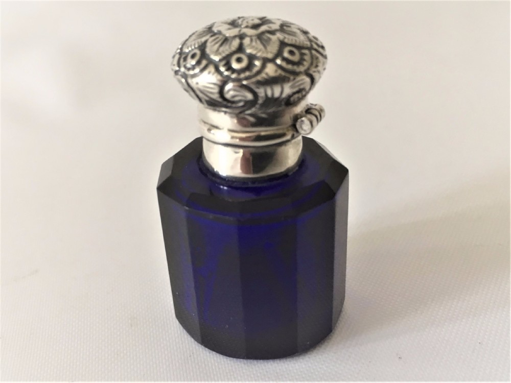 A Victorian silver mounted sapphire blue scent bottle.