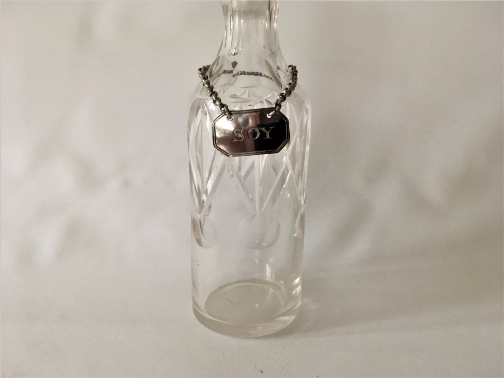 A rare Edwardian soy bottle with hallmarked silver label. View II