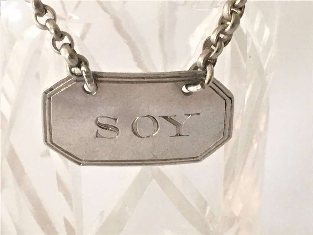 A rare Edwardian soy bottle with hallmarked silver label. View VI