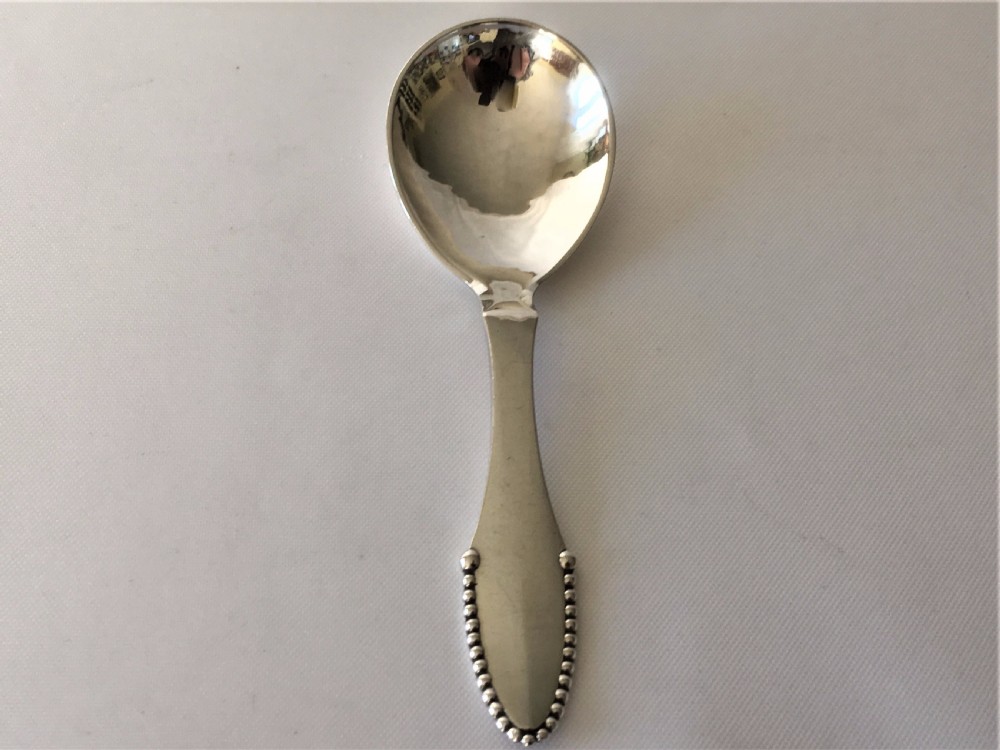 A superb Georg Jensen silver caddy spoon