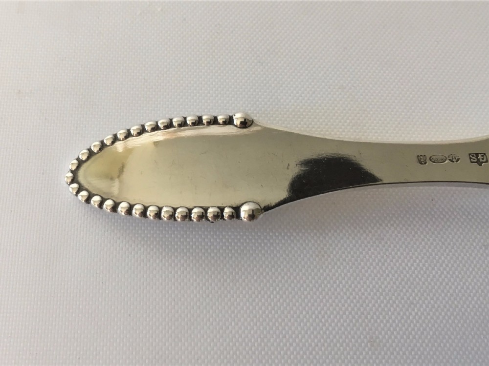 A superb Georg Jensen silver caddy spoon View V