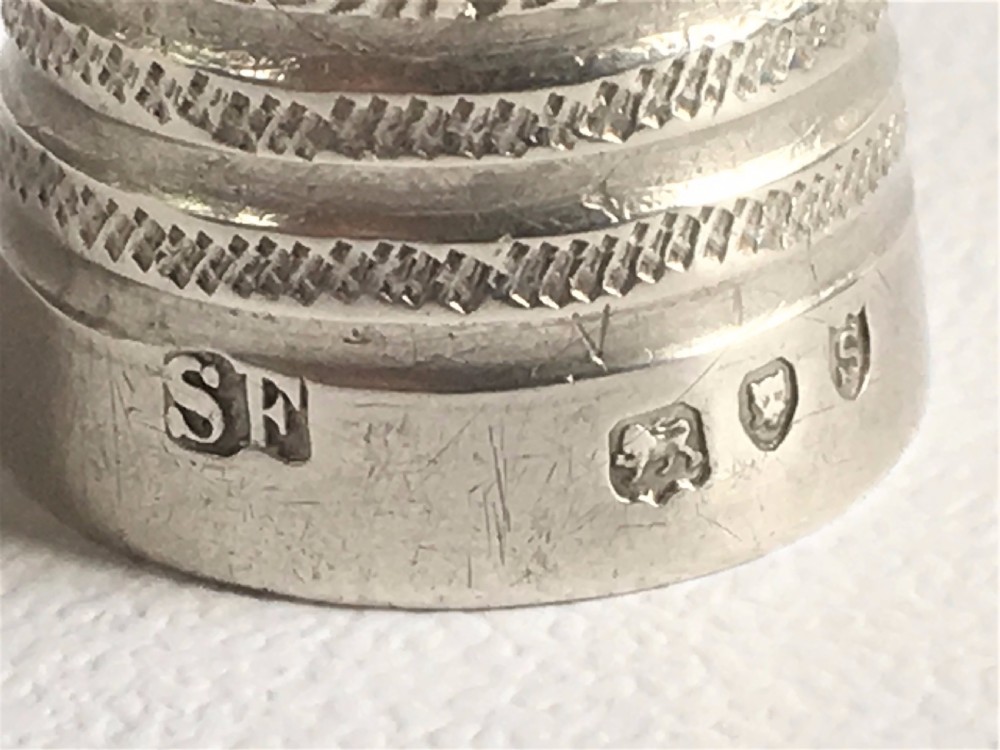 A gorgeous Victorian silver thimble in treen acorn case. View IV