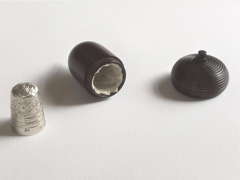 A gorgeous Victorian silver thimble in treen acorn case. View V