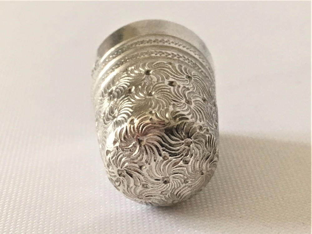A gorgeous Victorian silver thimble in treen acorn case. View XI