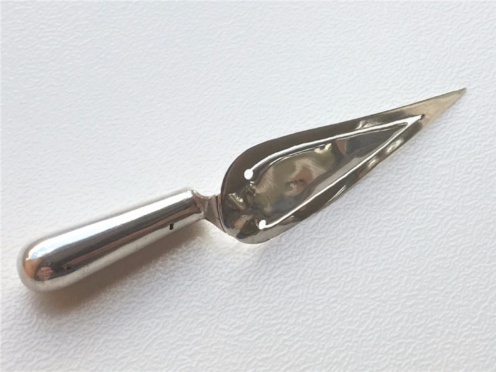 A charming Bright Cut silver trowel bookmark. View IV