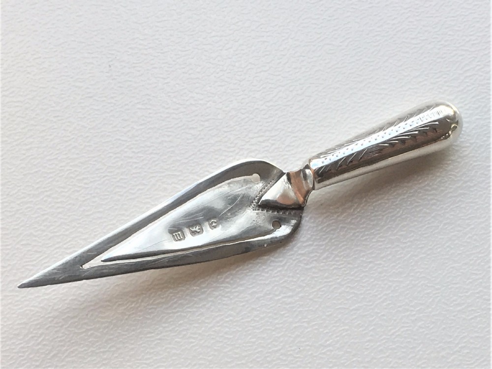 A charming Bright Cut silver trowel bookmark. View V