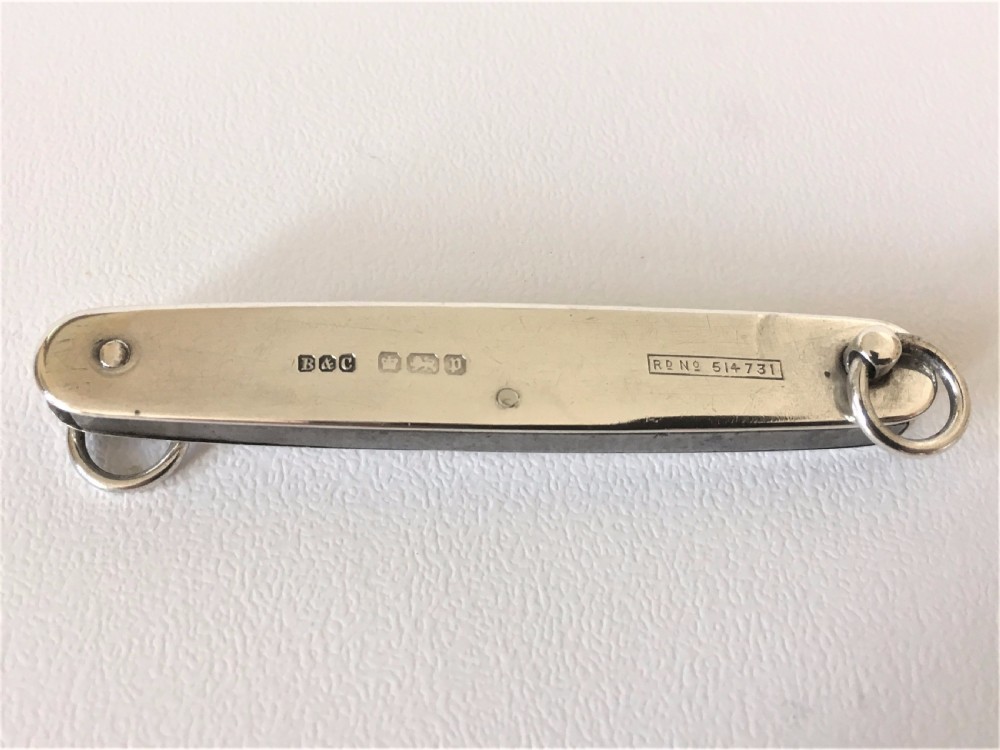 A rare silver folding knife and pencil combination View III
