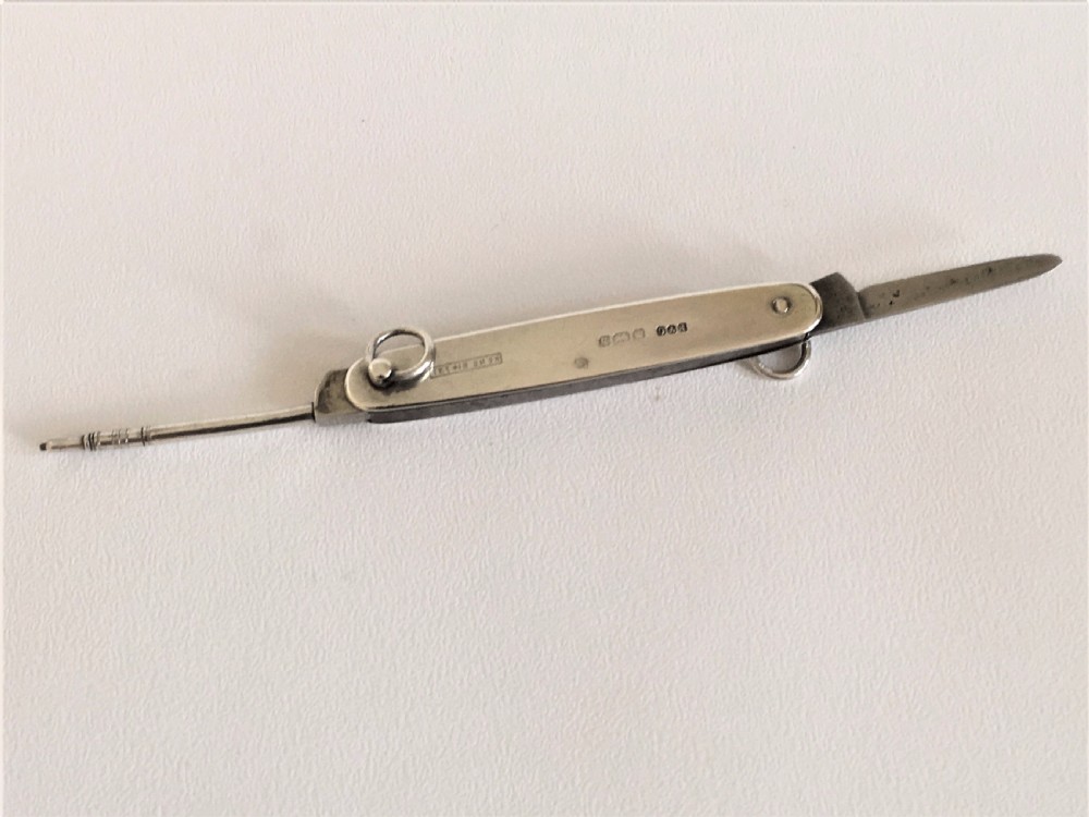 A rare silver folding knife and pencil combination View V