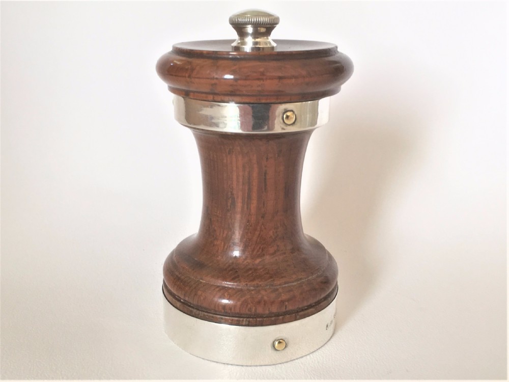 An Edwardian silver mounted pepper grinder