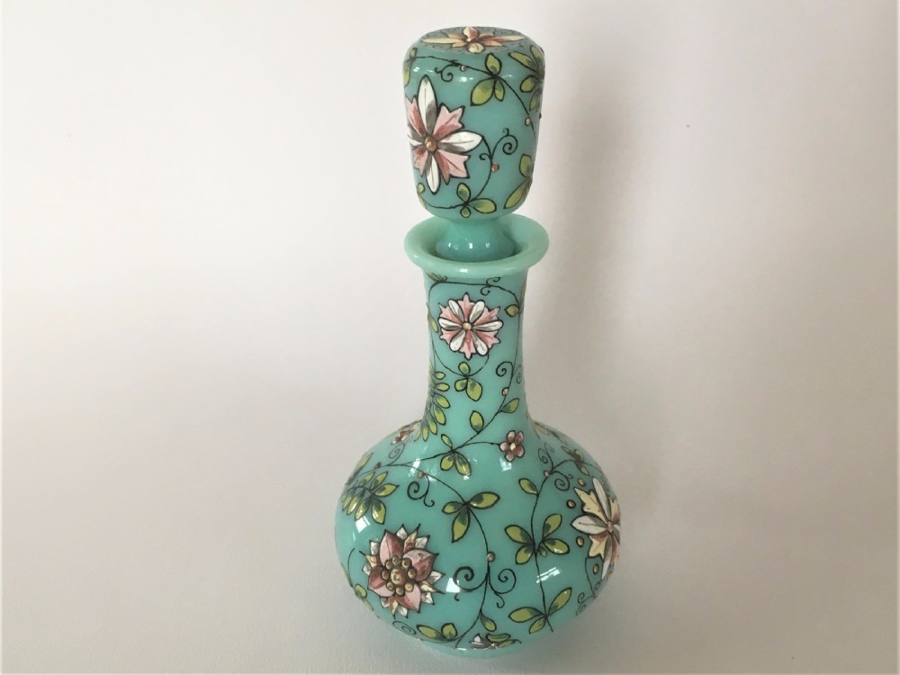 An enamel painted 19th Century glass scent bottle.