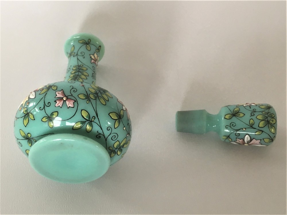 An enamel painted 19th Century glass scent bottle. View IV