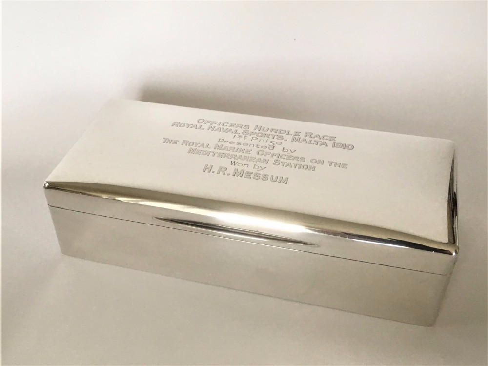 A superb silver table cigarette box. Malta Naval interest.