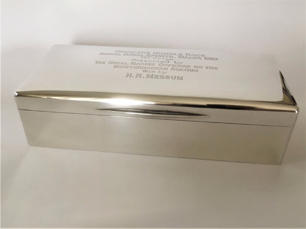 A superb silver table cigarette box. Malta Naval interest. View III