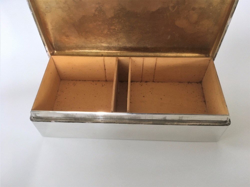 A superb silver table cigarette box. Malta Naval interest. View V