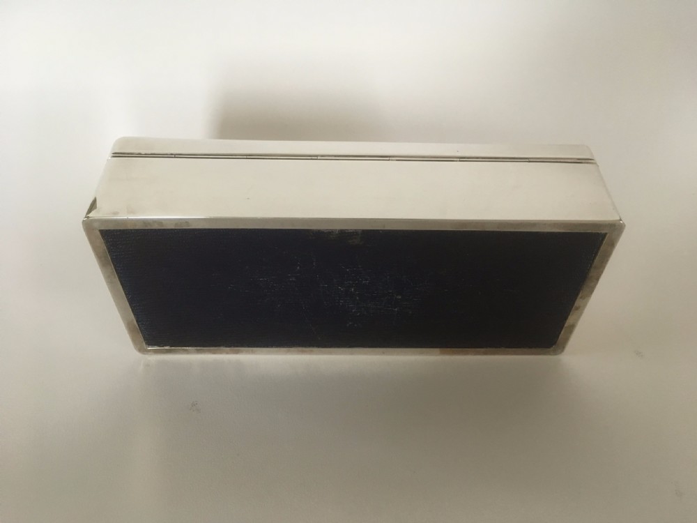A superb silver table cigarette box. Malta Naval interest. View IX