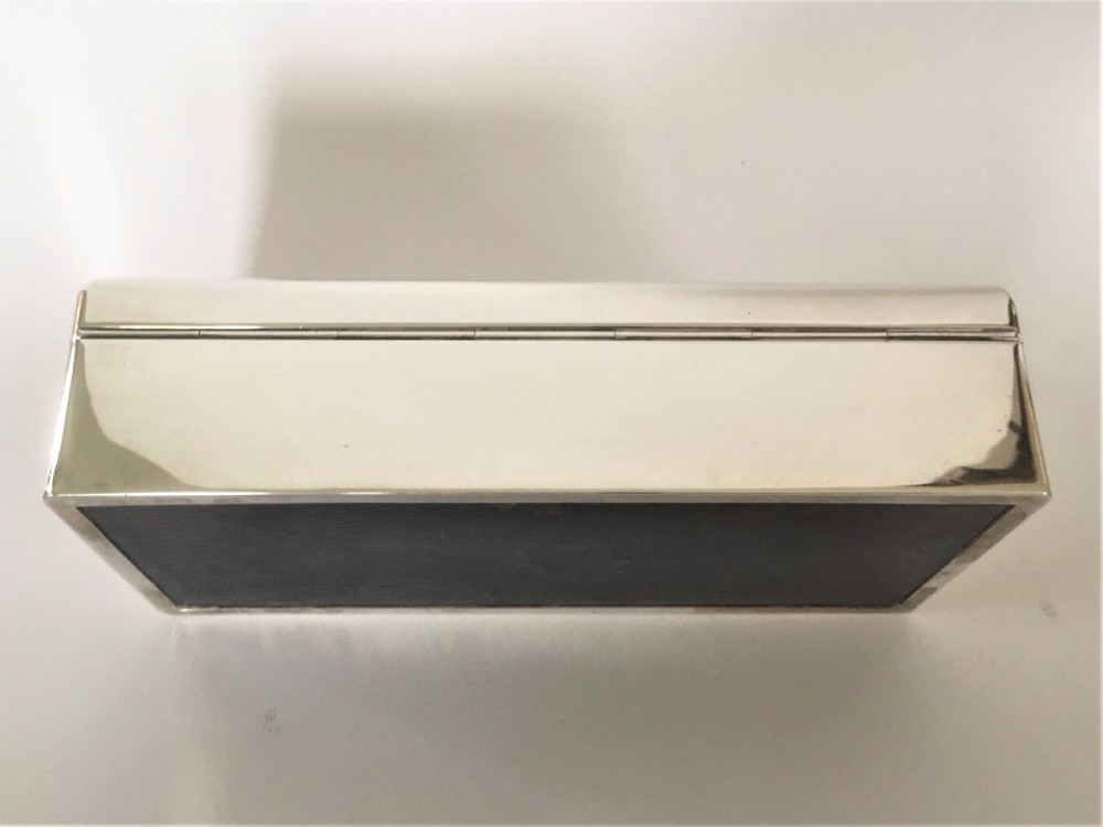 A superb silver table cigarette box. Malta Naval interest. View X