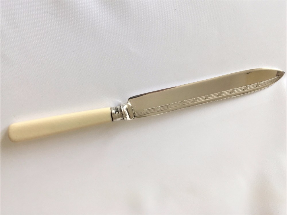 A good silver mounted cake knife.