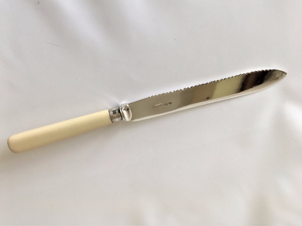 A good silver mounted cake knife. View III