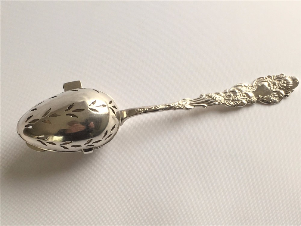 An unusual Edwardian silver tea infuser.