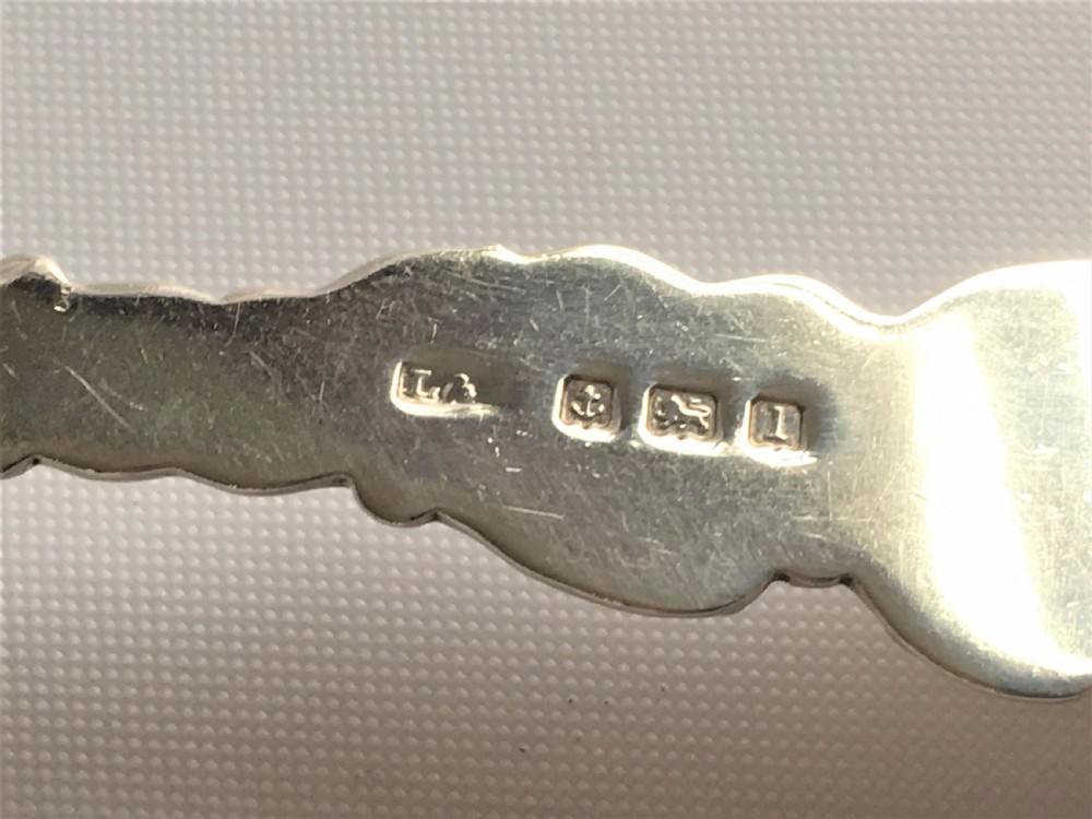 An unusual Edwardian silver tea infuser. View V