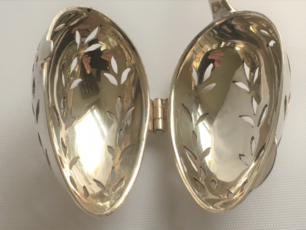 An unusual Edwardian silver tea infuser. View VII