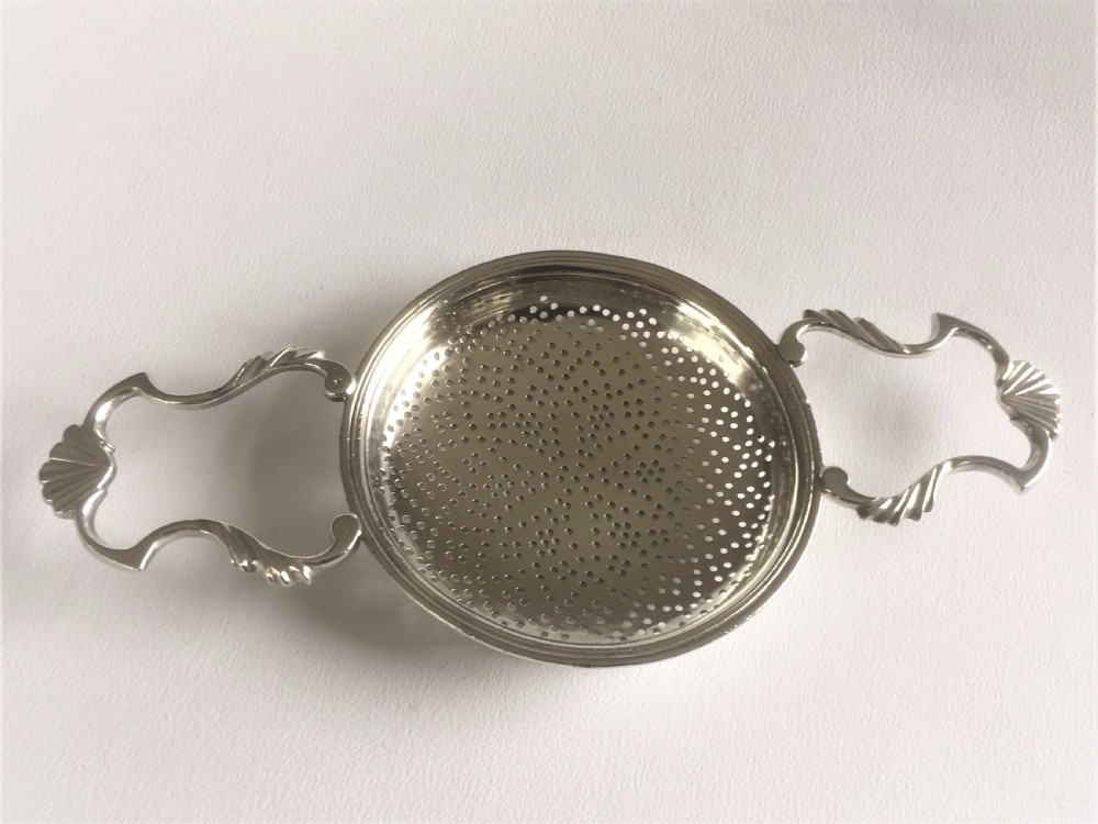 A fabulous silver lemon strainer