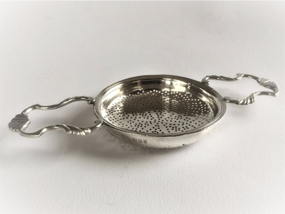 A fabulous silver lemon strainer View II
