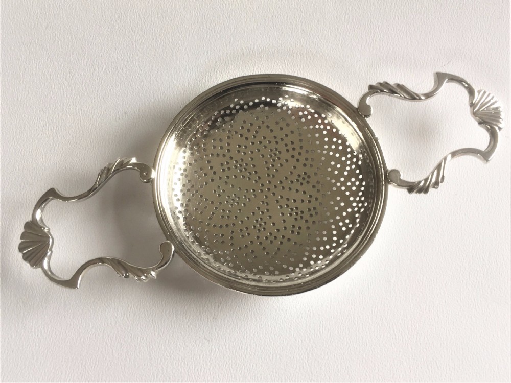 A fabulous silver lemon strainer View III