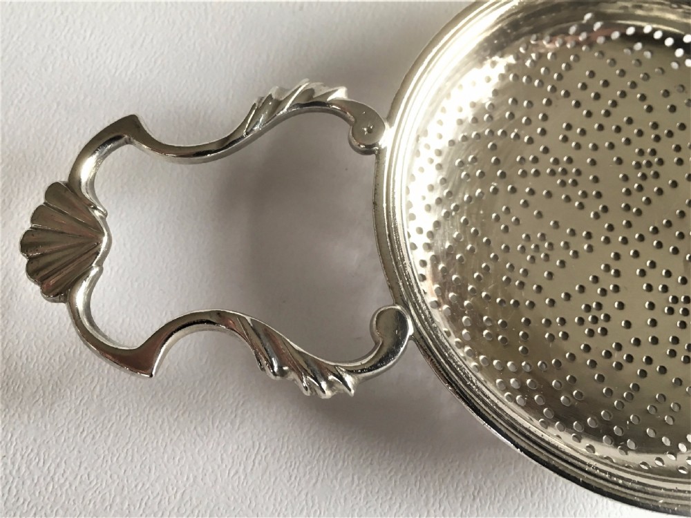 A fabulous silver lemon strainer View V