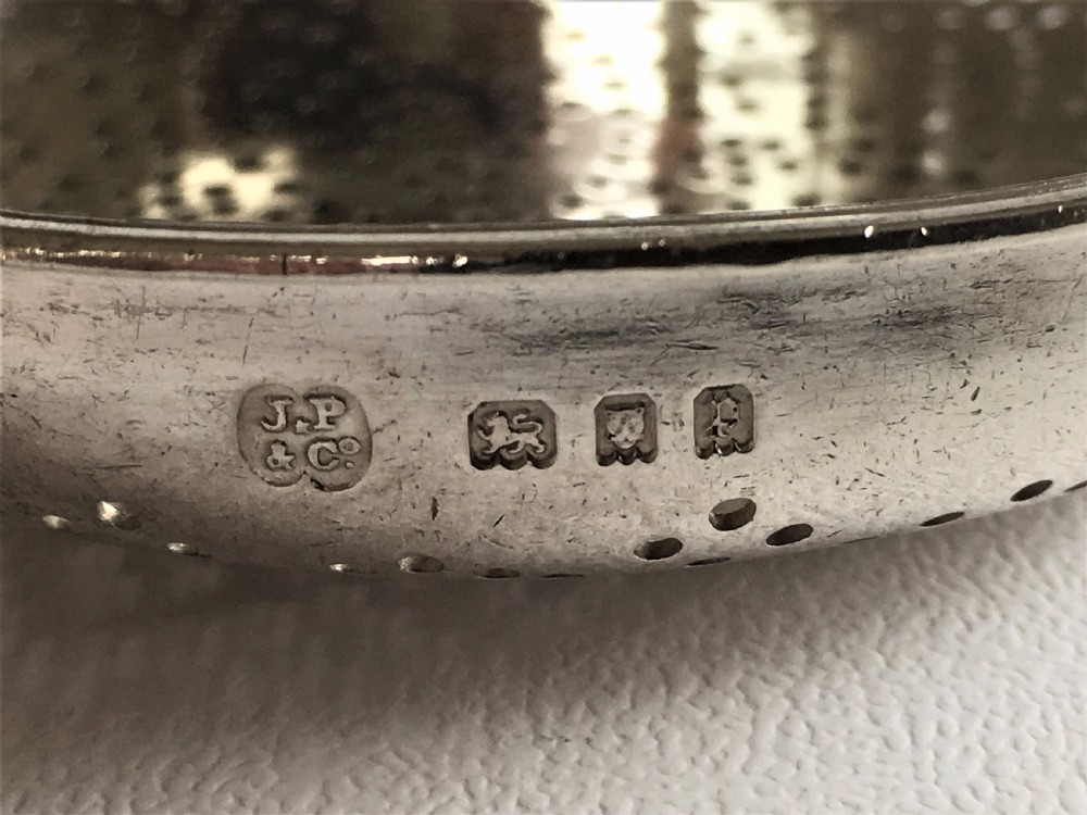 A fabulous silver lemon strainer View VII