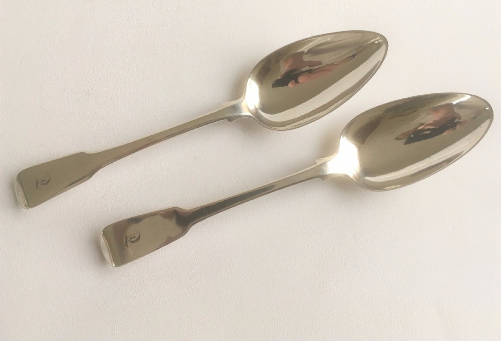 An excellent pair of Georgian silver serving spoons