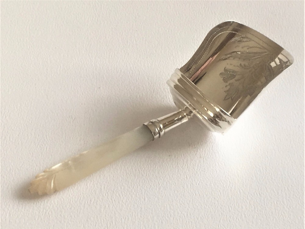 A gorgeous Victorian silver caddy shovel