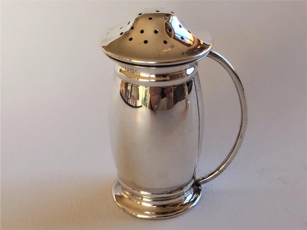 A stylish silver cruet with green liners and spoons View IV