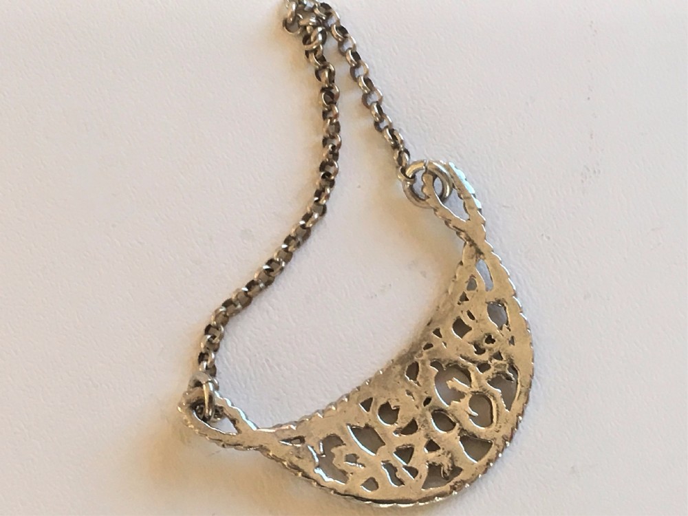 An unusual cast Victorian silver Port label View III